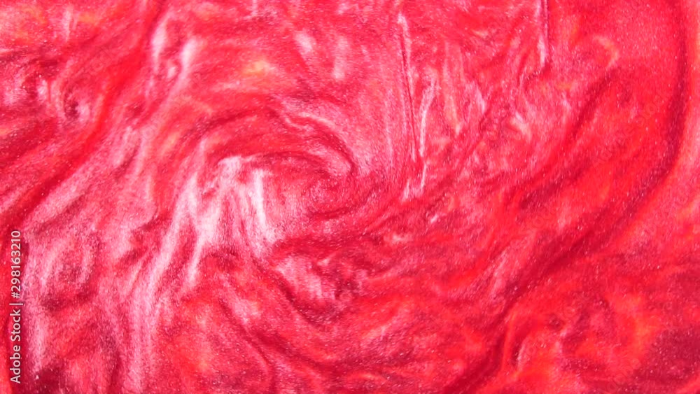 red liquid with sparkles and pearly shine. abstract background. Slow motion red liquid with sparkles and pearly shine. abstract background. Slow motion