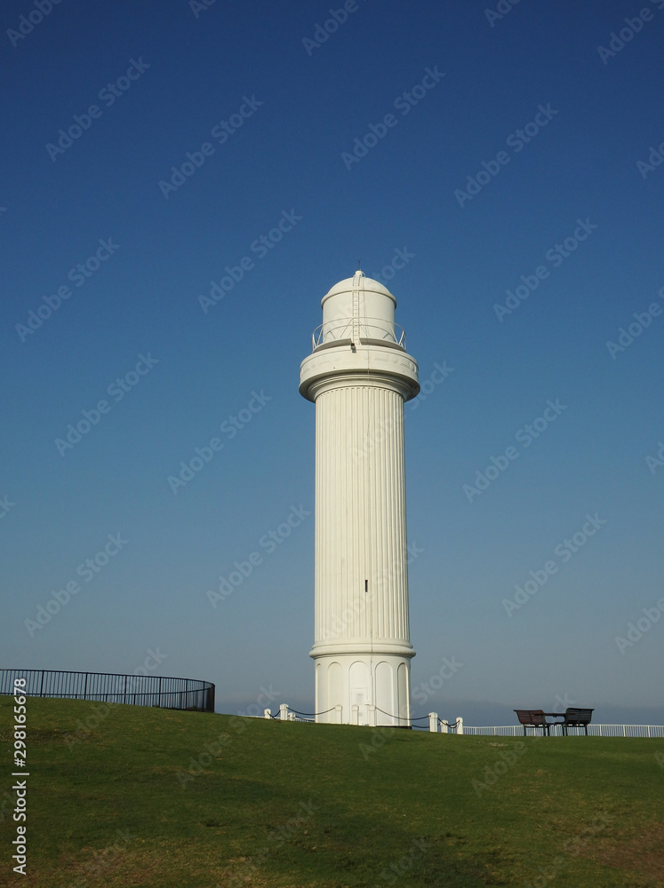 Classic old lighthouse on sunset in australia