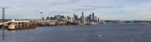 Downtown Seattle, Washington, United States of America. Aerial Panoramic View of the Modern City on the Pacific Ocean Coast during a sunny and cloudy Autumn Day.