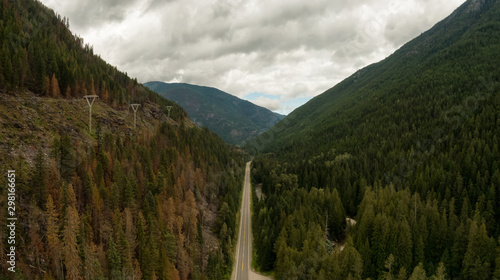 Aerial Panoramic View of a Scenic Highway in the Valley surrounded by Canadian Mountain Landscape. Taken near Creston, British Columbia, Canada. photo