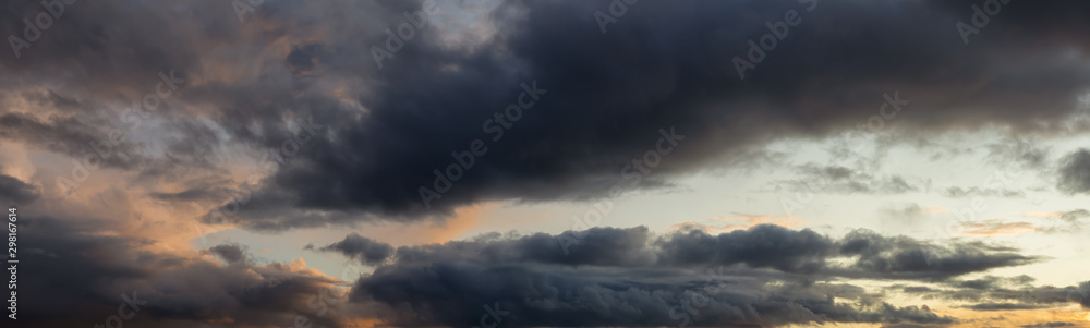 Dramatic Panoramic View of a cloudscape during a dark, rainy and colorful sunset. Taken in Alaska, USA. Dramatic Panoramic View of a cloudscape during a dark, rainy and colorful sunset. Taken in Alaska, USA.