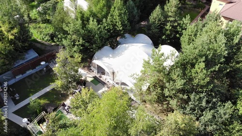 A wedding tent in a beautiful forest, frames from a drone for your event and celebration