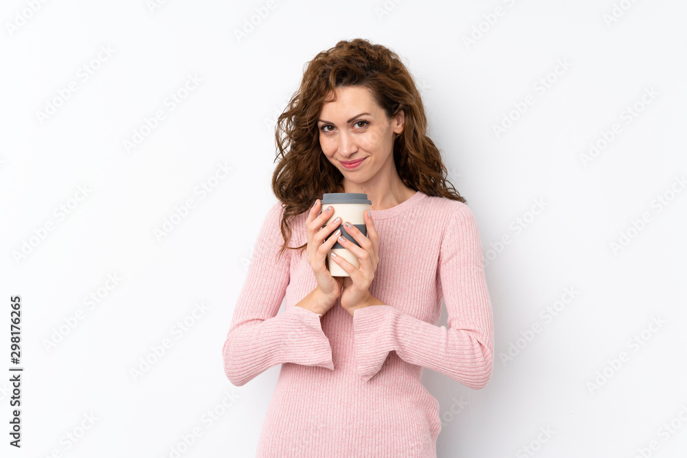 Young pretty woman over isolated background holding coffee to take away Young pretty woman over isolated background holding coffee to take away