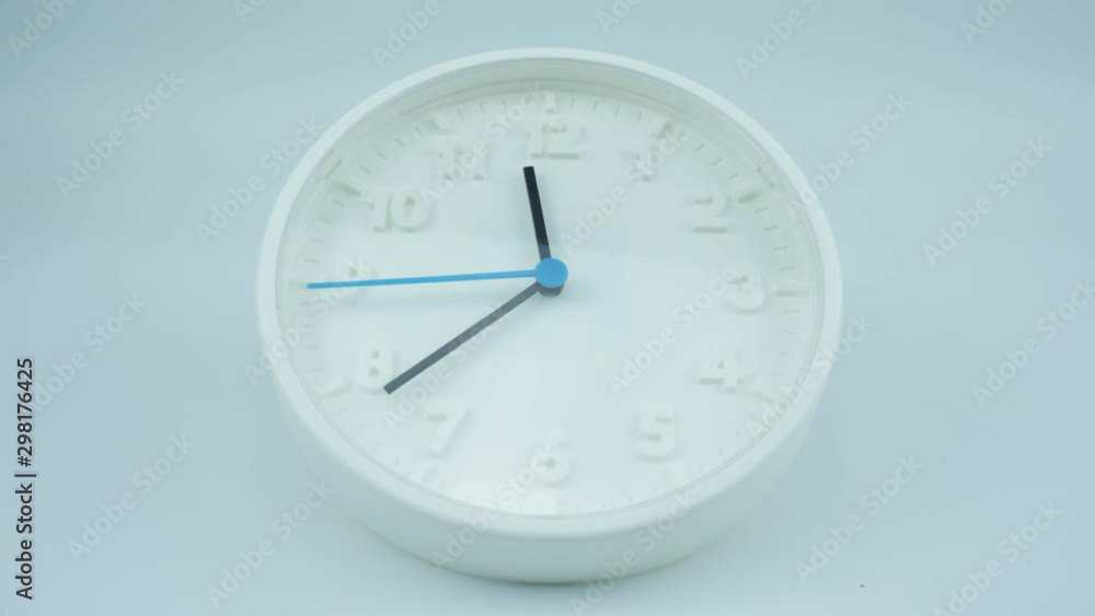 White wall clock face beginning of time 11.30 am or pm. on white background, Time lapse moving fast. White wall clock face beginning of time 11.30 am or pm. on white background, Time lapse moving fast.