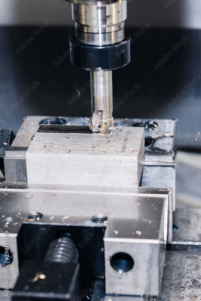 Metalworking CNC milling machine. Cutting aluminium parts in modern processing technology. Metalworking CNC milling machine. Cutting aluminium parts in modern processing technology.