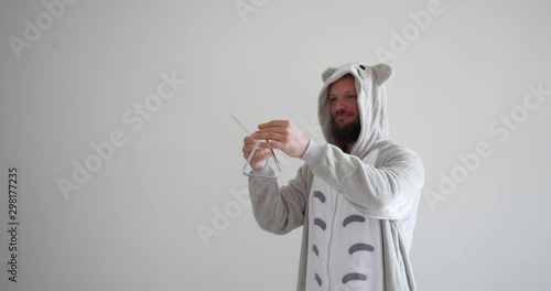 Triangle solo music played by handsome bearded white dad wearing totoro kigurumi pajama clothe.