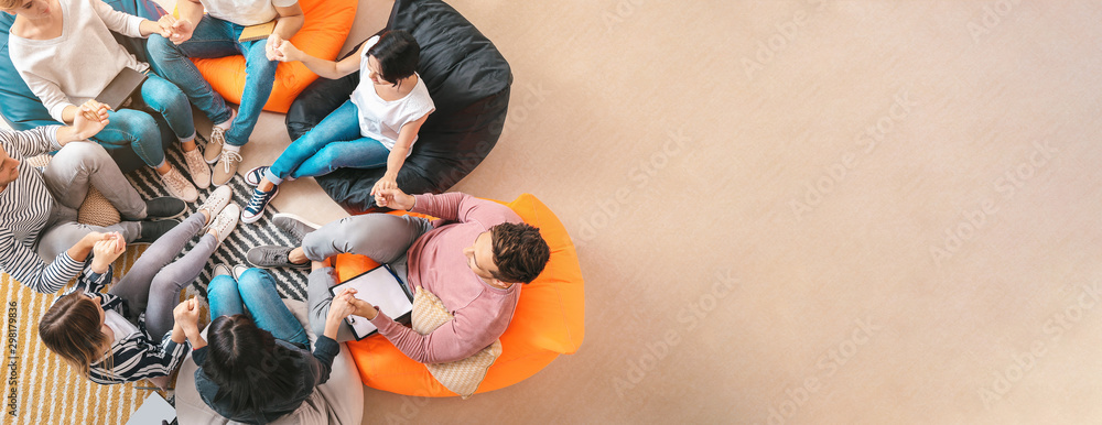 People holding hands at group therapy session - obrazy, fototapety, plakaty 