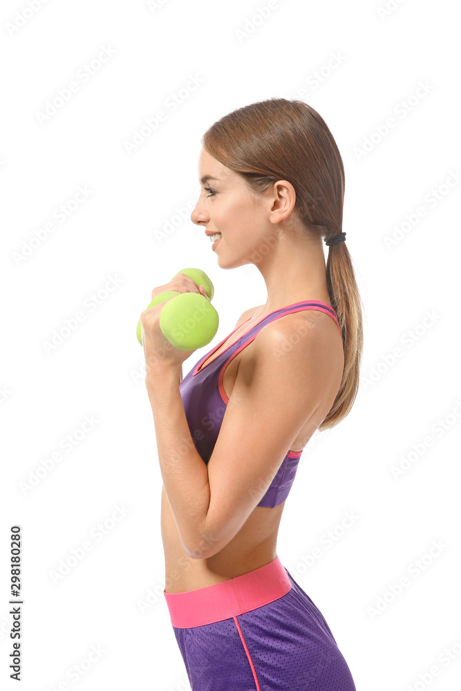 Sporty young woman training with dumbbells against white background Sporty young woman training with dumbbells against white background