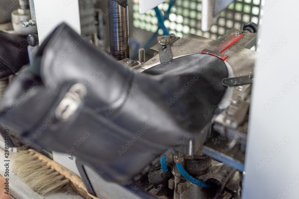 Fototapeta premium Forming the front part on a special machine. Shoe production.