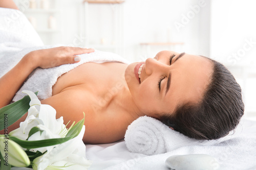 Beautiful woman relaxing in spa salon