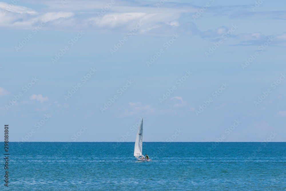Beautiful yacht on middle clear blue sea for background use 