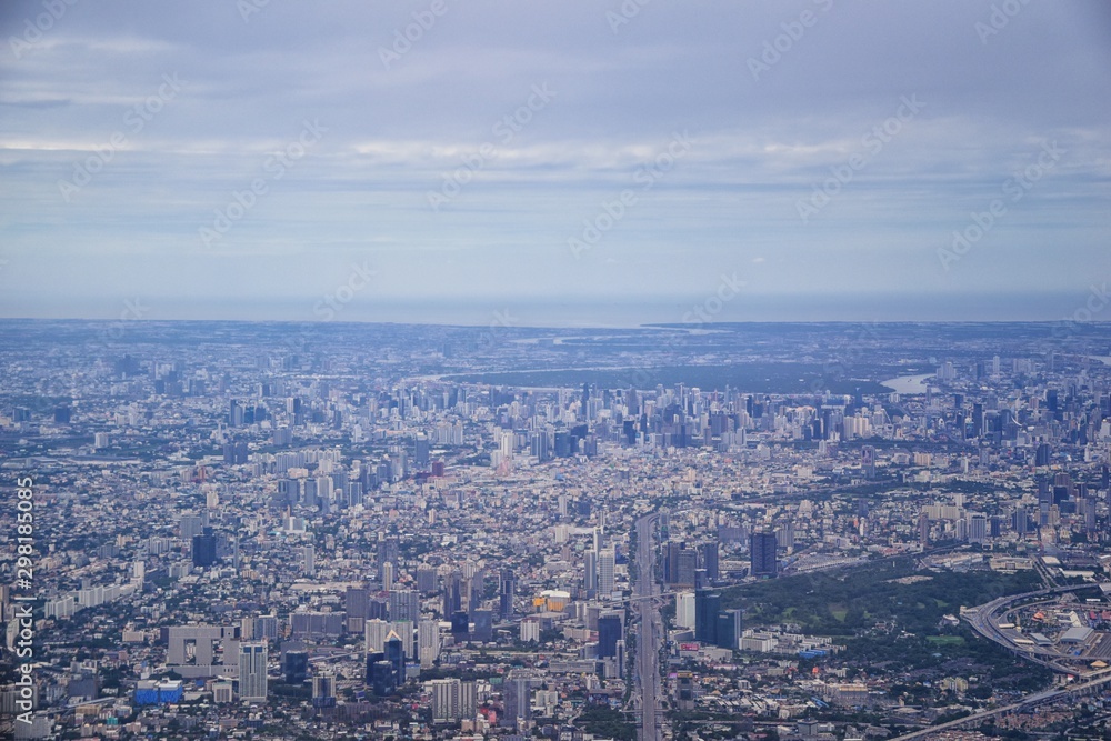 Aerial view of Bangkok Thailand and surrounding landscape, modern office buildings, condominium, living place in Bangkok city downtown in the most populated. Southeast Asia.