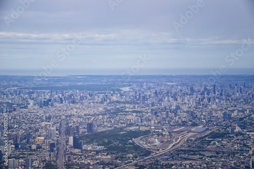 Aerial view of Bangkok Thailand and surrounding landscape, modern office buildings, condominium, living place in Bangkok city downtown in the most populated. Southeast Asia.