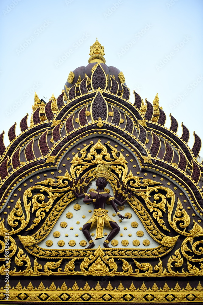 Beautiful thai temple decorated with sculptures an gold