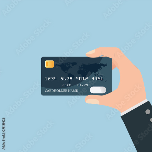 Hand holding credit card.