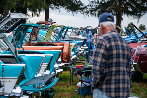 1950s car trunks open at a car show