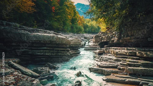 4K UHD Cinemagraph / seamless video loop of the mountain river Taugl in Austria, close to Mozart birthplace Salzburg. The water is rushing through naturally formed rocks. photo