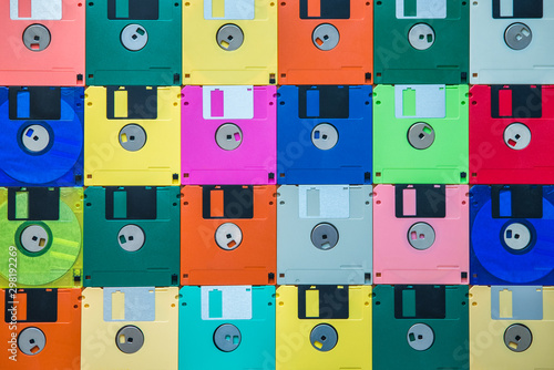 Background from multi-colored diskettes. Colored floppy disks.