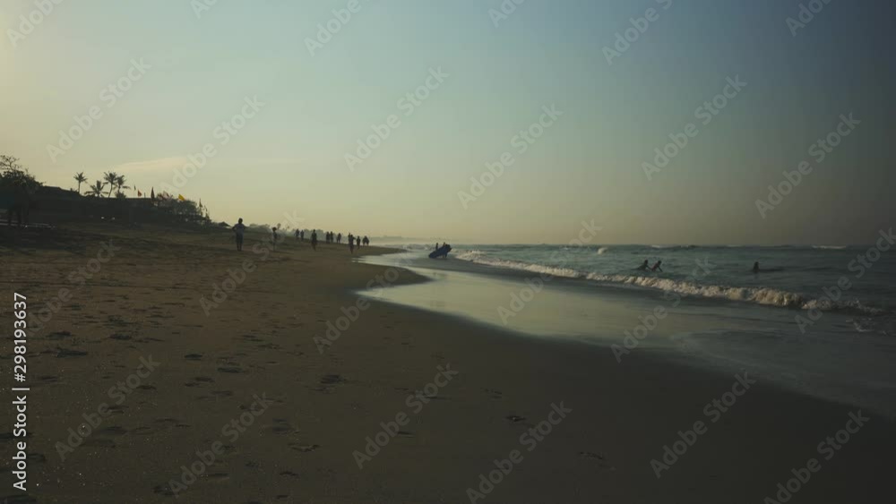 Bali ocean beach at morning time with people lifestyle Bali ocean beach at morning time with people lifestyle