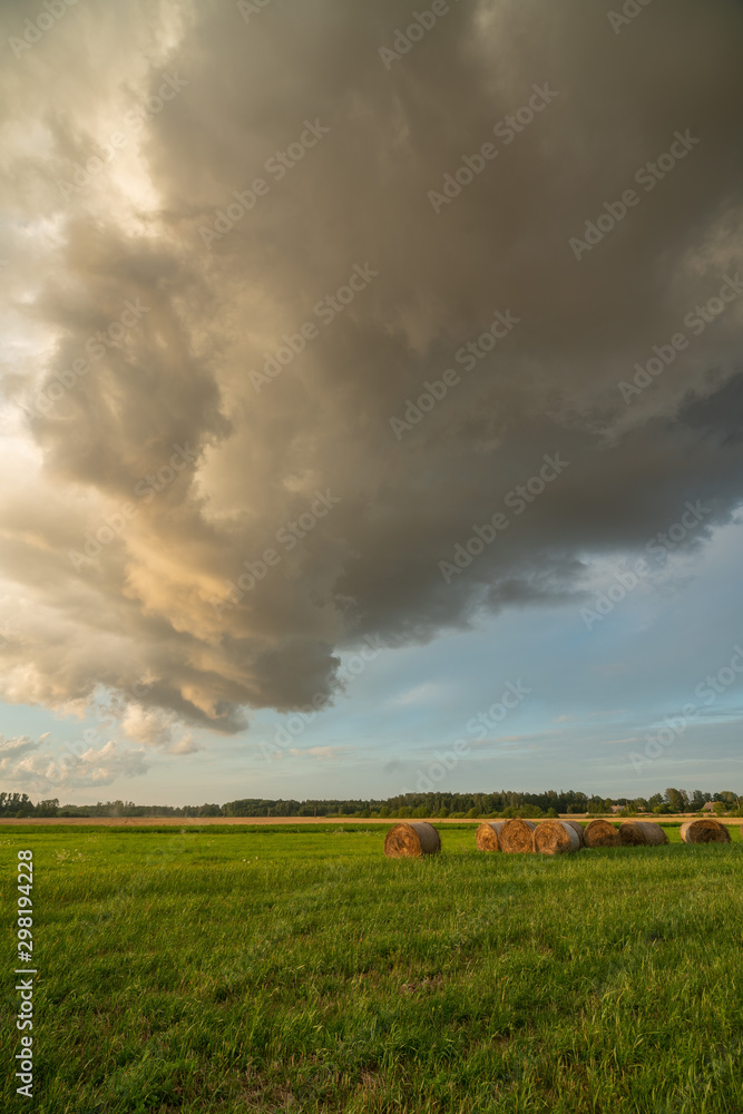 Fototapeta premium stormy clouds at sunset time