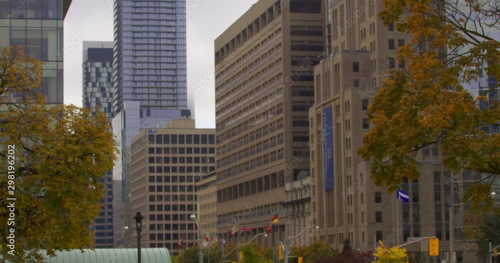 Wide shot of a city street with a slow pan up to the sky Wide shot of a city street with a slow pan up to the sky