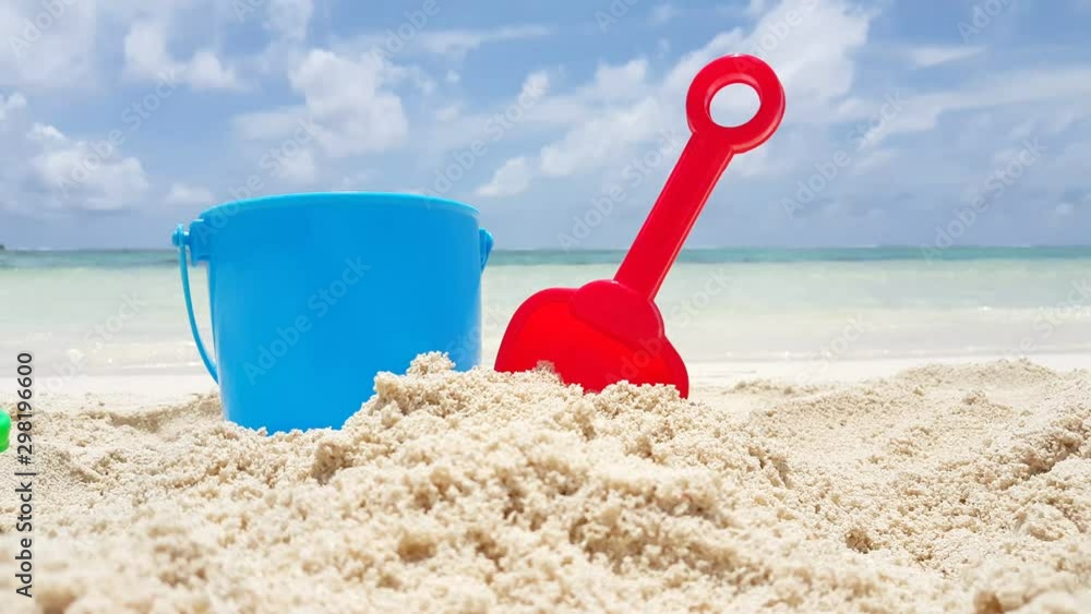 Plastic bucket and shovel in the sand Plastic bucket and shovel in the sand