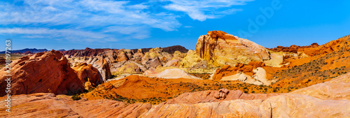 Panorama of the colorful red, yellow and white banded rock formations along the Fire Wave Trail in the Valley of Fire State Park in Nevada, USA