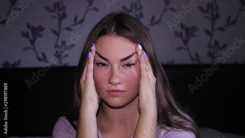 Beautiful teenage girl having a headache photo