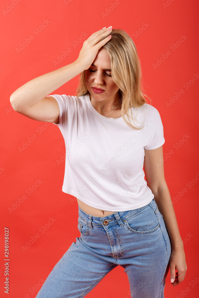 Girl holding a hand on the head as she realizes that she has forgotten about doing something imported Girl holding a hand on the head as she realizes that she has forgotten about doing something imported