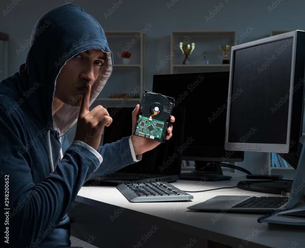 Hacker hacking computer at night Hacker hacking computer at night