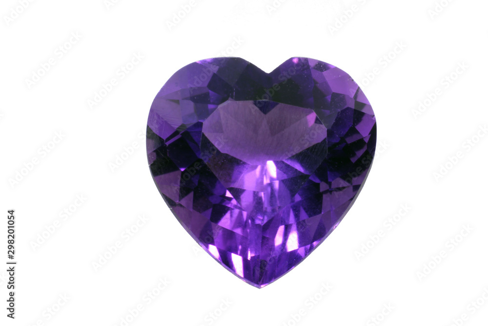 Amethyst ruby in the shape of heart isolated on white background. Purple shiny gem. 