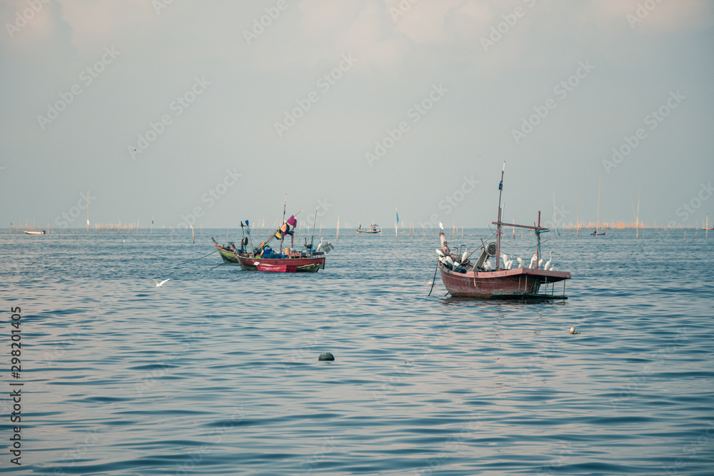 Fishing boats on the sea with blue sky  background.Bang Saen Beach,Chonburi district,Thailand.