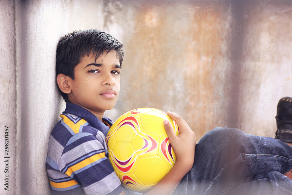 Portrait of Indian boy holding the football Portrait of Indian boy holding the football
