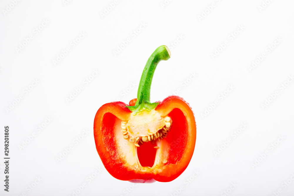 Sweet peppers on a white background,sliced bell peppers,Half cut chilli, Organic vegetables Sweet peppers on a white background,sliced bell peppers,Half cut chilli, Organic vegetables