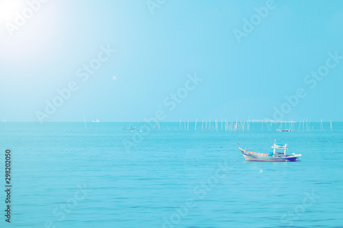 Fishing boats on the sea with blue sky  background.Bang Saen Beach Chonburi district Thailand.