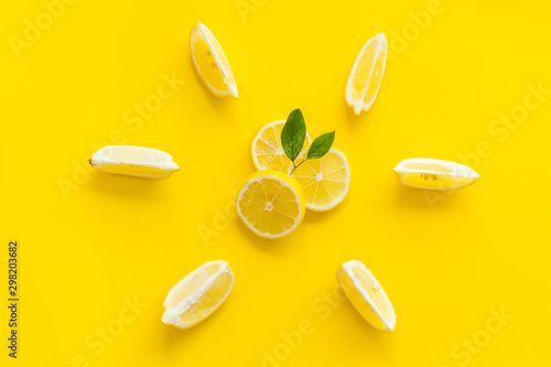 Lemon pattern on yellow background top view