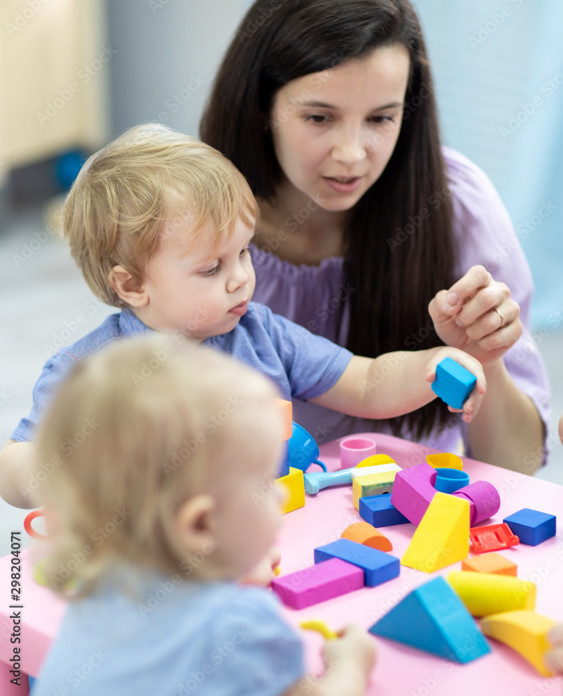 mother and daughter playing with blocks mother and daughter playing with blocks