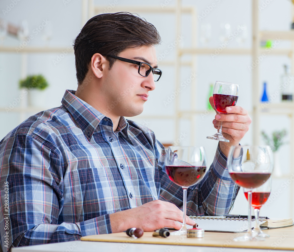 Professional sommelier tasting red wine Professional sommelier tasting red wine