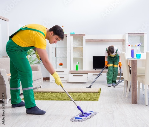 Cleaning professional contractors working at house © Elnur