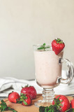 strawberry smoothie with mint on the table, front view