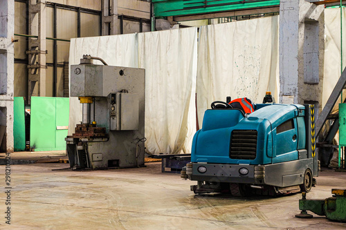 Canvas Print Floor sweeper and washer scrubber drier car in an industrial building engineerin
