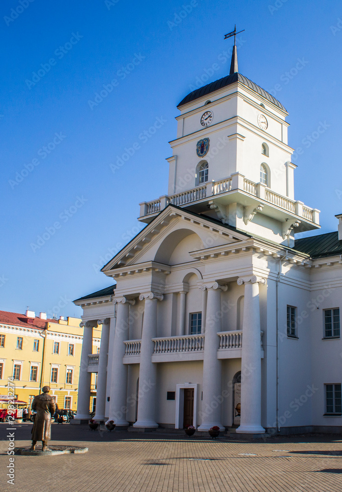 Naklejka premium Minsk/Belarus - October 23 2019: City Hall of Minsk. Medieval clock tower. Europe architecture. Beautiful clean buildings.