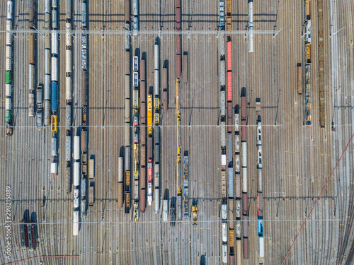 Aerial view of freight train wagons on large railway track field. Concept of modern logistics.