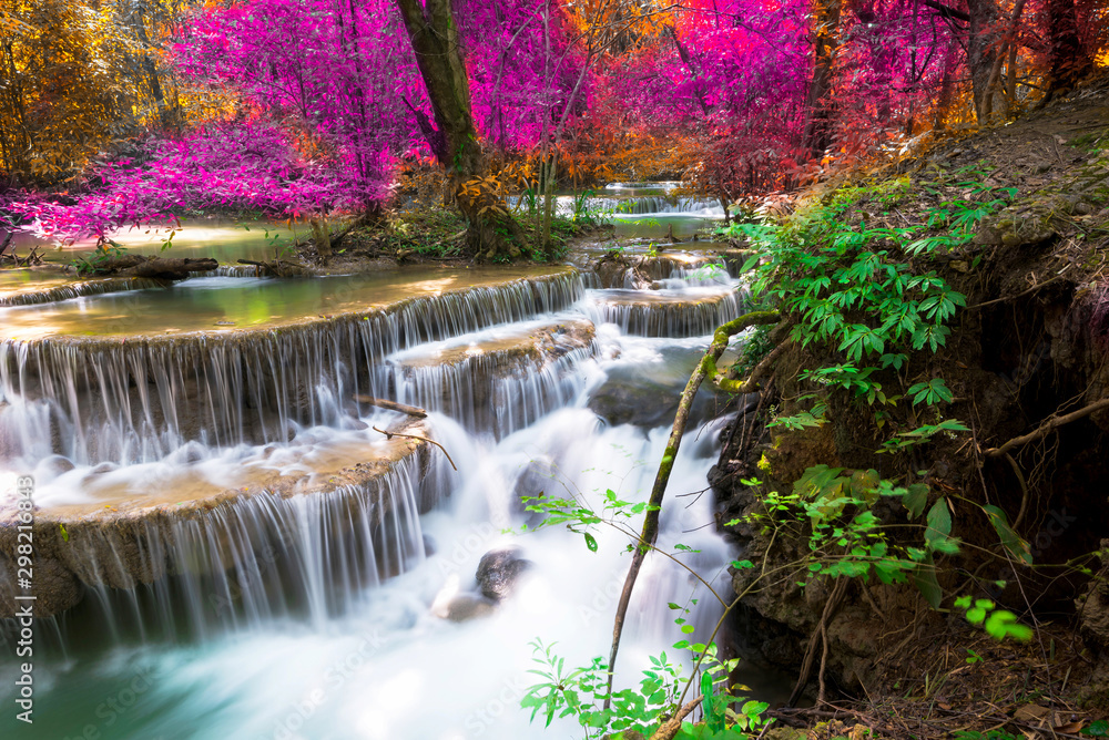 Fototapeta Amazing in nature, beautiful waterfall at colorful autumn forest in fall season