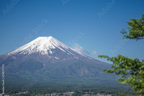 Beautiful view Mt. Fuji with snow  blue sky and fresh grass in summer at Yamanashi  Japan.