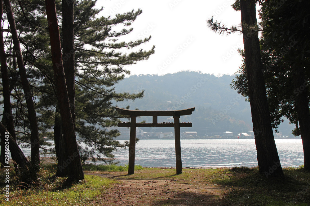 torii on the littoral in amanohashidate (japan) torii on the littoral in amanohashidate (japan)