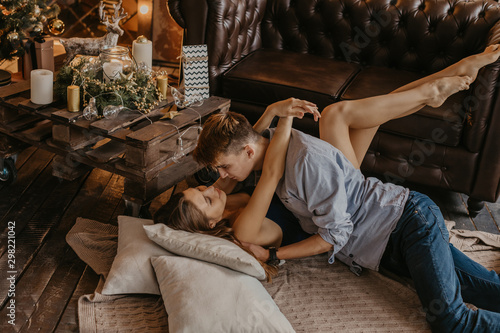 Romantic couple in love feeling happiness about their romance spending christmas eve together- Image