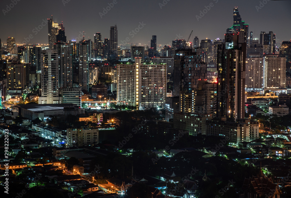 Fototapeta premium Sky view of Bangkok with skyscrapers in the business district in Bangkok In the night beautiful twilight give the city a modern style.