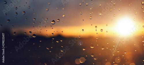 Tableau sur toile Raindrops on a windowpane at sunset panorama