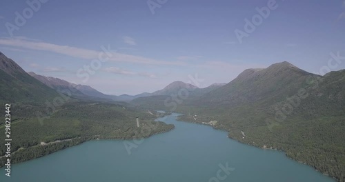 Drone shot flying above the Cook Inlet in South Central Alaska and towards the beautiful Alaskan Wilderness. Shot during midday on a summer day. photo